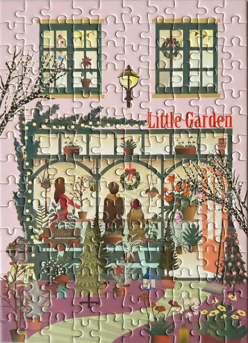 Puslespill med julepyntet hagebutikk