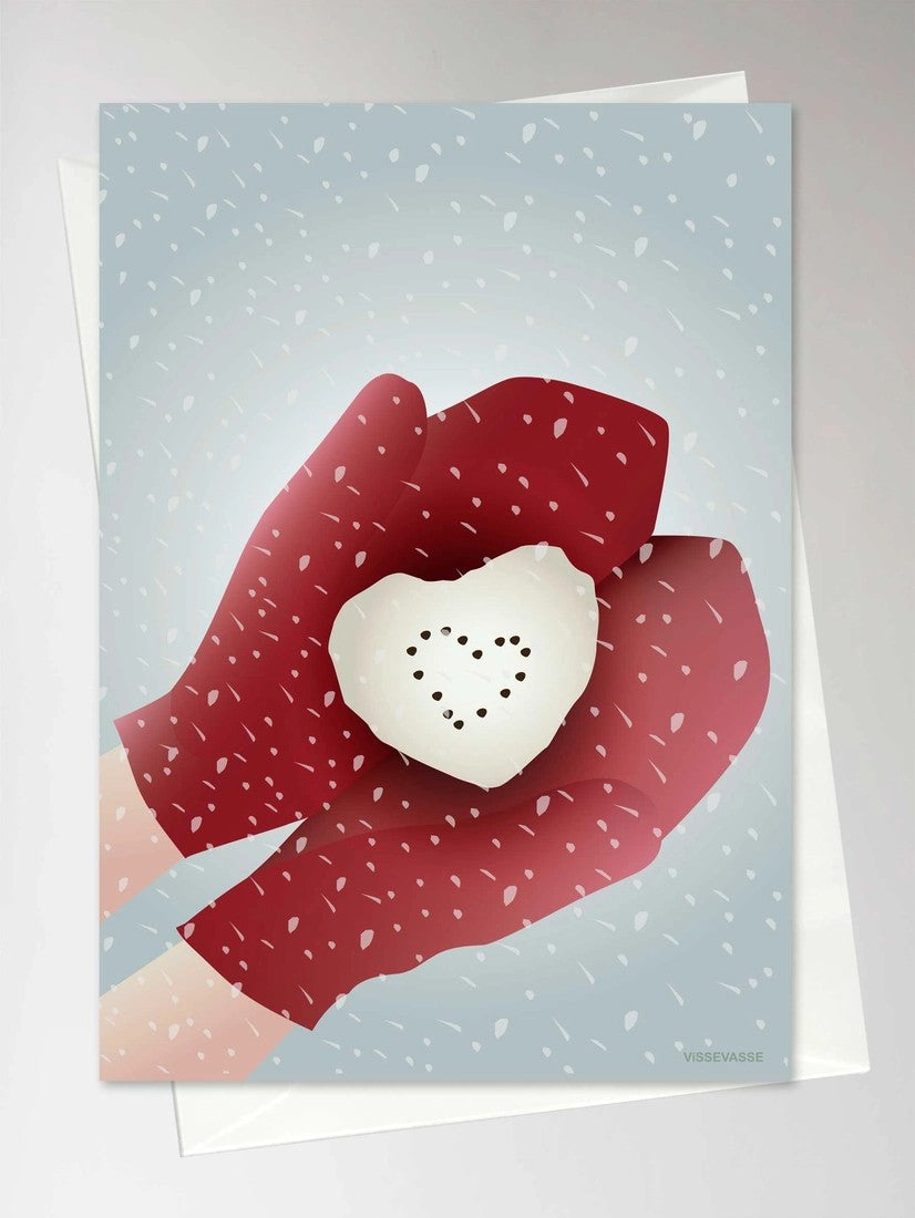 Røde votter som holder et snøballhjerte